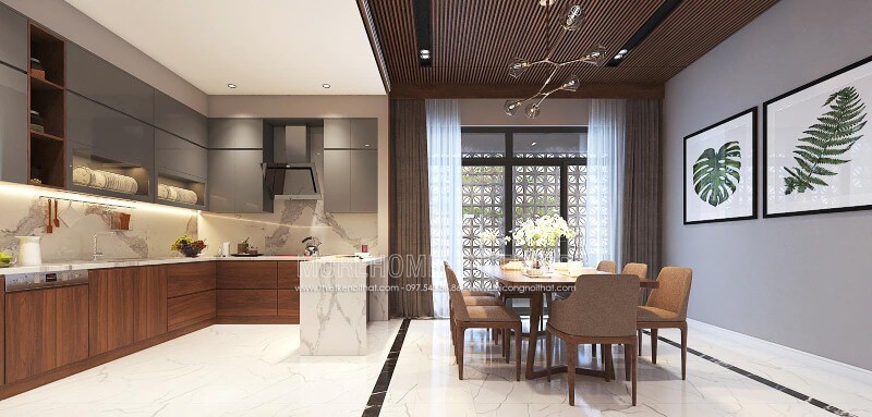 Trang trí nội thất phòng bếp liền phòng ăn sang trọng, độc đáo với nội thất gỗ chủ đạo từ tủ bếp, bộ bàn ghế, tường ốp gỗ tại biệt thự, nhà phố Vinh, Nghệ An. Thiết kế nội thất