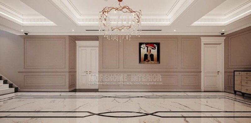 Trang trí hành lang đẹp ấn tượng với họa tiết độc đáo từ sàn lát đá cùng đường chỉ tường ấn tượng, bức tranh điểm nhấn kết hợp với nét tinh tế từ đèn trần cao cấp. công ty thiết kế nội thất cao cấp