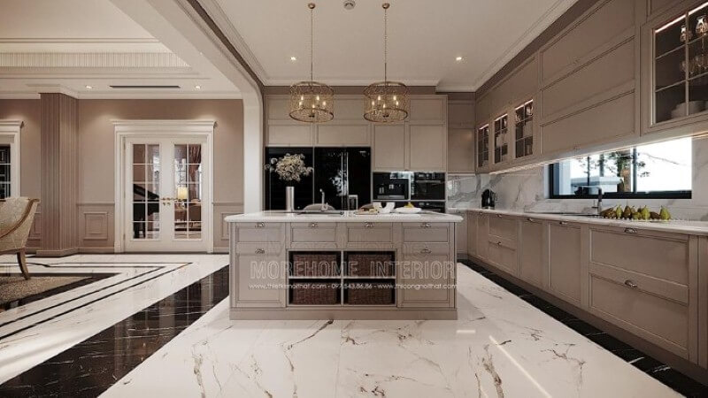 Bàn đảo bếp tân cổ điển ốp đá đẹp sang trọng với thiết kế nhiều hộc tủ cùng các ô mở giúp không gian trở nên linh động, tiện nghi. công ty thiết kế nội thất cao cấp